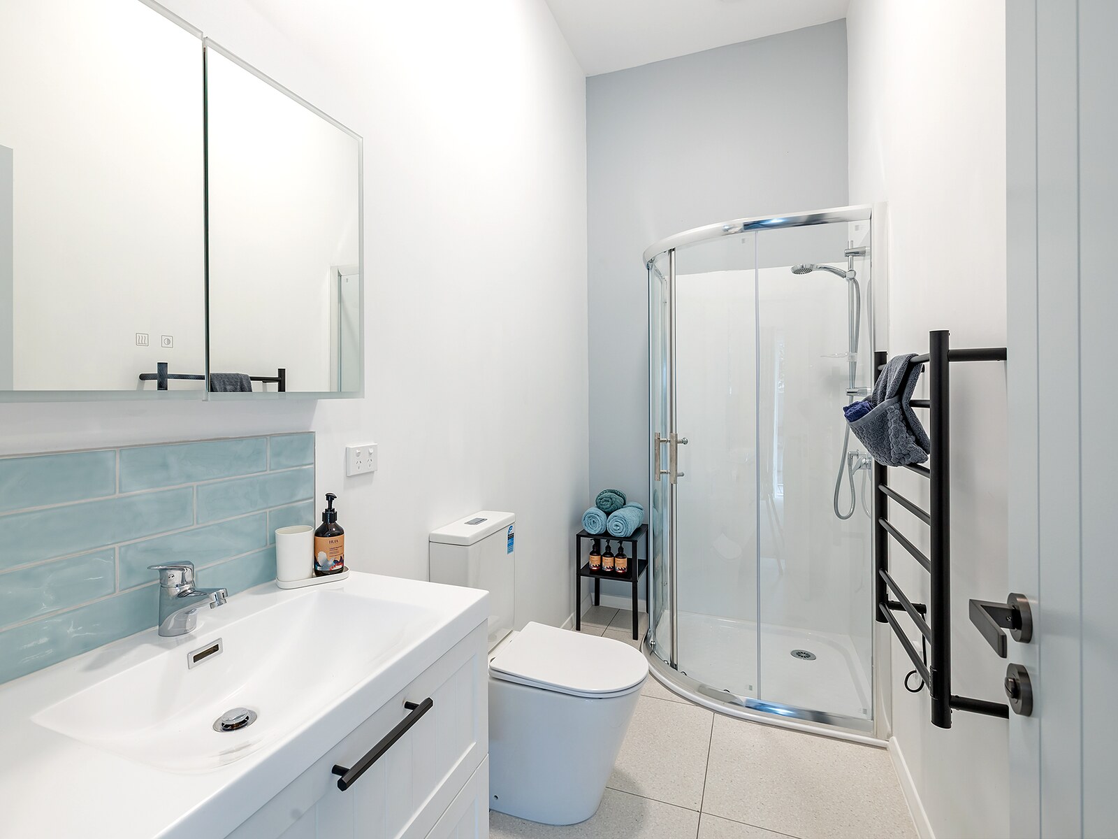 Modern bathroom with shower, heated towel rail and vanity