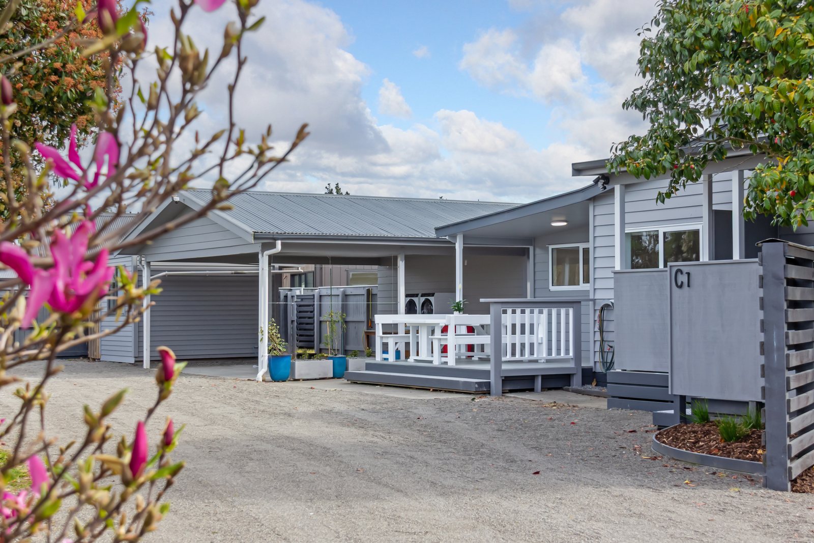 A suite entrance — privacy screen, steps and covered deck