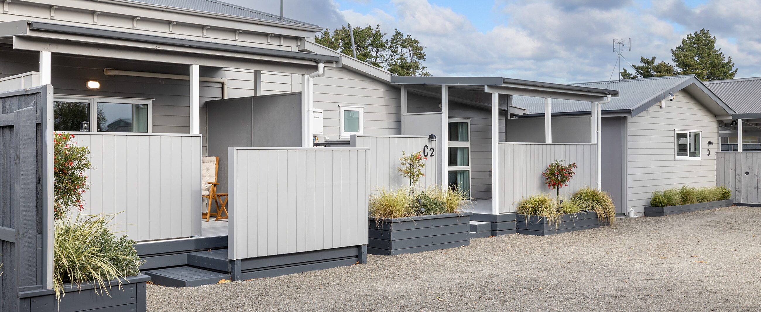 The George Wing — three suite entrances along one building, each screened from the next